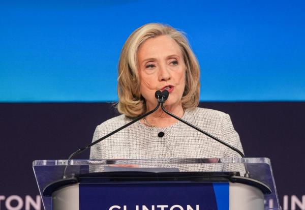 Former U.S. Secretary of State Hillary Clinton speaking into a microphone at the Clinton Global Initiative 2024 Annual Meeting in New York City.